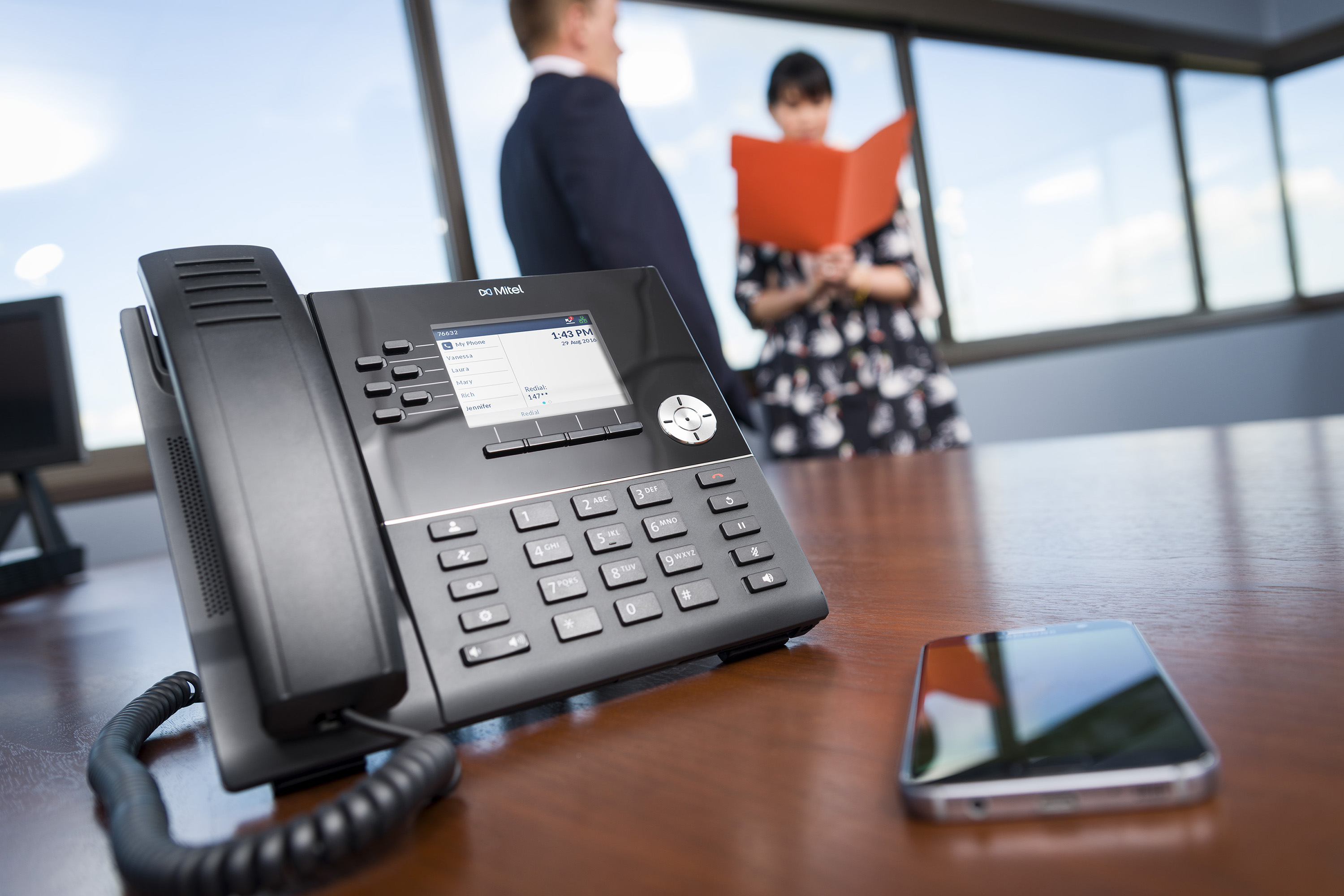 Mitel 6920 on Desk with Smartphone